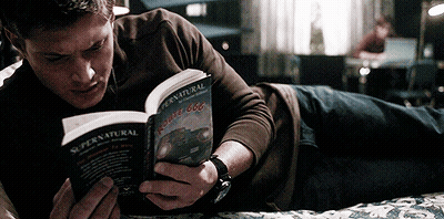 Man Reading Supernatural Book In Bed GIF