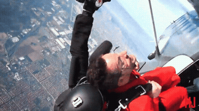 Man Red Jacket Flying With N On Helmet GIF