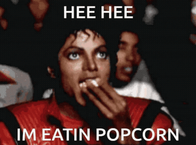 Man Red Jacket Hee Hee Im Eatin Popcorn GIF