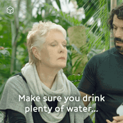 Man Reminding Old Woman To Drink Water Plenty GIF