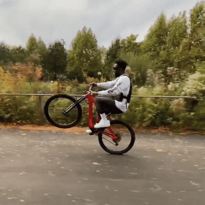 Man Riding Bicycle With Supreme On Back GIF