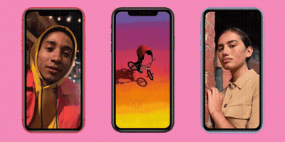 Man Riding Bike And Woman Next To Brick Wall GIF