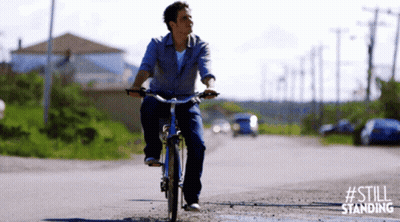 Man Riding Bike Down Dirt Road GIF