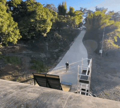 Man Riding Bike Down Hill GIF