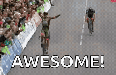 Man Riding Bike Down Road Saying Awesome GIF