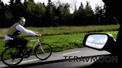 Man Riding Bike Down Road Teravmoon GIF