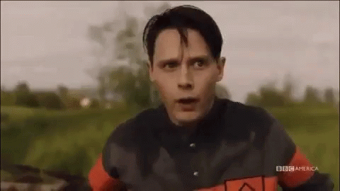 Man Riding Bike In Field GIF