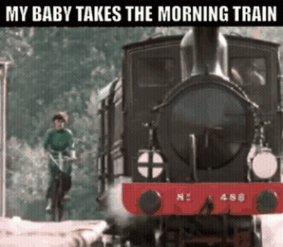 Man Riding Bike In Front Of Train Saying My Baby Takes The Morning Train GIF