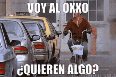 Man Riding Bike Saying Voy Al Oxxo