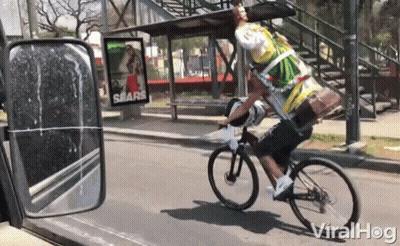 Man Riding Bike With Sears Ad GIF