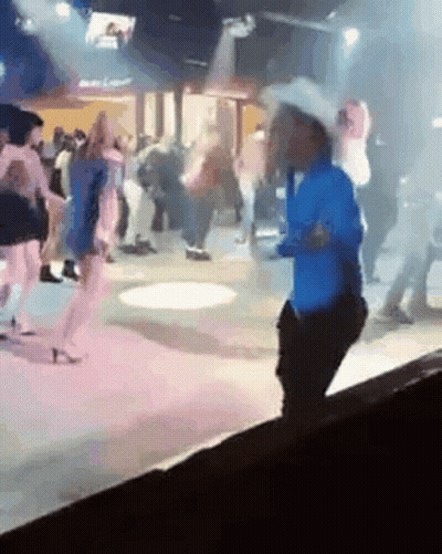 Man Riding Bull In Rodeo Arena GIF