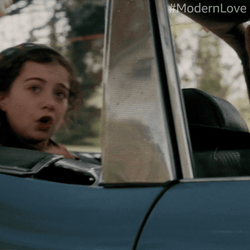 Man Riding Car With Ear Plugs On GIF