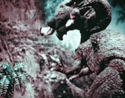 Man Riding Dinosaur GIF