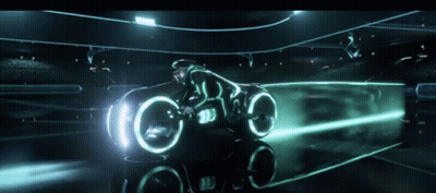 Man Riding Futuristic Motorcycle With Glowing Lights GIF