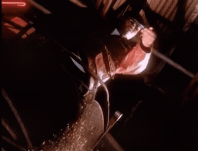 Man Riding Horse In Dark Room With Neon Sign GIF