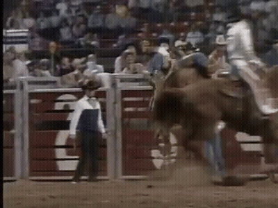 Man Riding Horse In Rodeo With Man Behind GIF