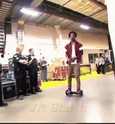 Man Riding Hoverboard With Jr Smith On Floor GIF