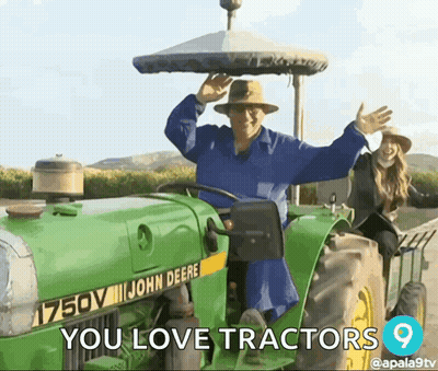Man Riding John Deere Tractor With Woman On Back GIF