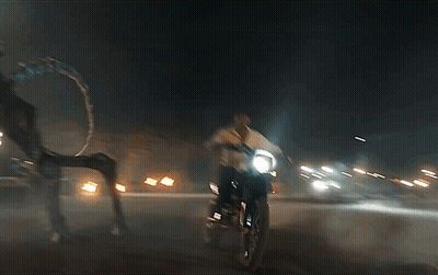 Man Riding Motorcycle At Night With Headlight GIF