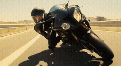 Man Riding Motorcycle Down Highway GIF
