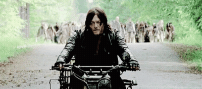 Man Riding Motorcycle From Zombie Crowd