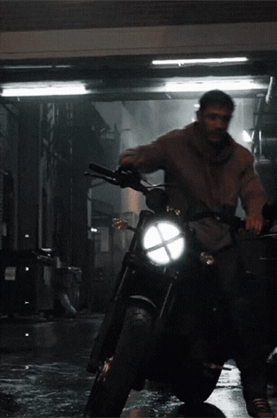 Man Riding Motorcycle In Dark Alley GIF