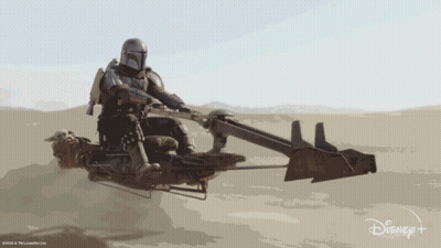 Man Riding Motorcycle In Desert With Disney+ Logo GIF