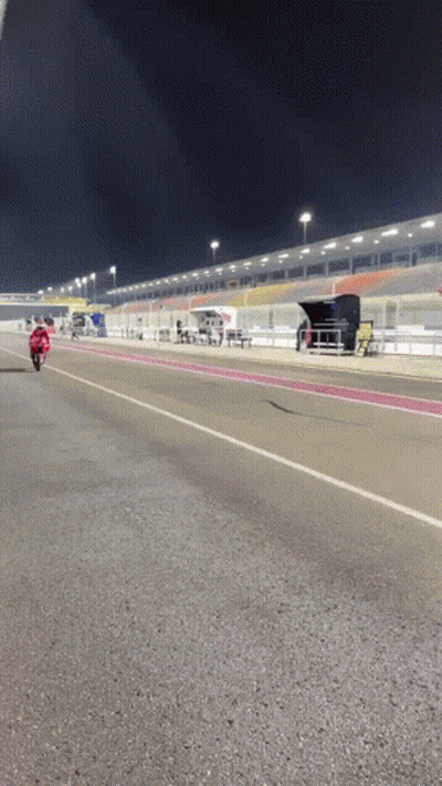 Man Riding Motorcycle On Race Track At Night GIF