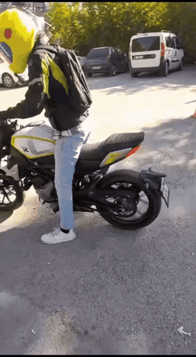 Man Riding Motorcycle With TC 88 License Plate GIF