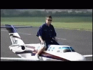 Man Riding On Back Of Small Airplane Number N70 GIF