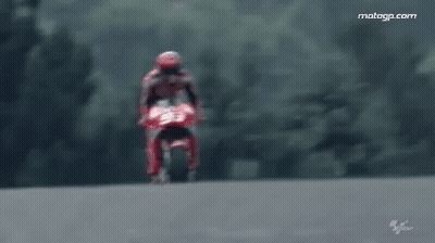 Man Riding Red Motorcycle On Track GIF