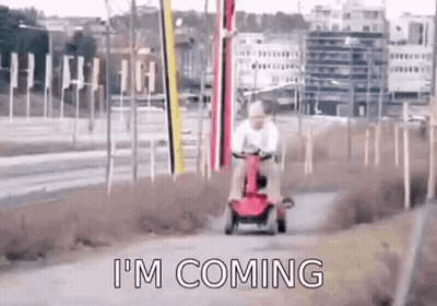 Man Riding Red Scooter GIF