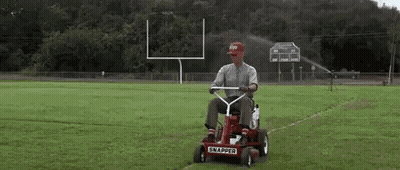Man Riding Red Snapper Lawn Mower