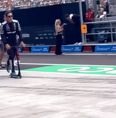 Man Riding Scooter On Race Track Number 23 GIF