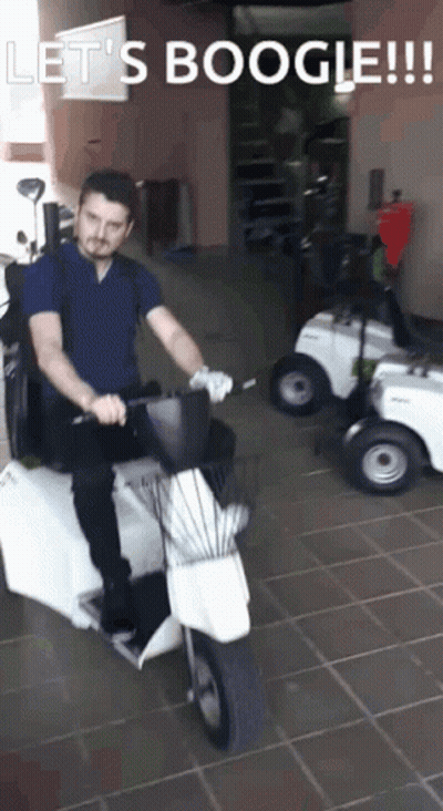 Man Riding Scooter Saying Let's Boogie GIF