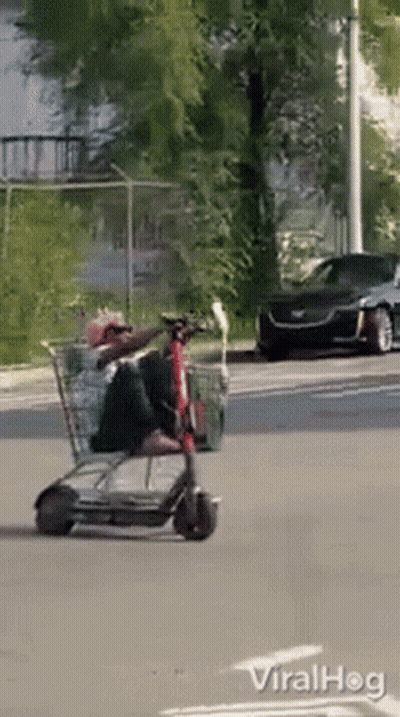 Man Riding Shopping Cart Scooter GIF