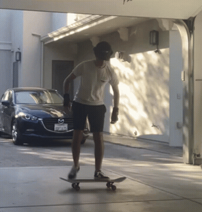 Man Riding Skateboard In Front Of Mazda GIF