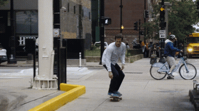 Man Riding Skateboard Near One Way Sign GIF