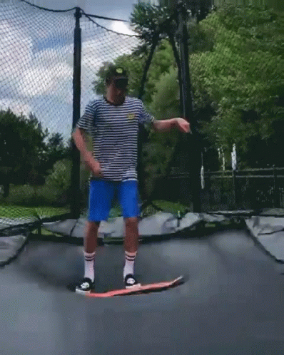 Man Riding Skateboard On Trampoline GIF