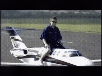 Man Riding Small Airplane N470 GIF