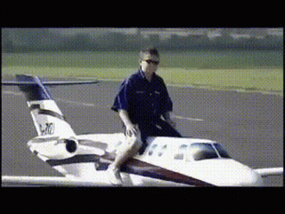 Man Riding Small Airplane P-10 GIF