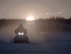 Man Riding Snowmobile Sunset Silhouette GIF