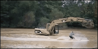 Man Riding Water Ski Next To Excavator GIF