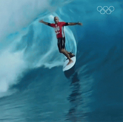 Man Riding Wave On Surfboard With Olympics Logo GIF