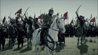 Man Riding White Horse Before Army GIF