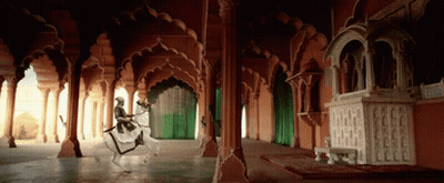 Man Riding White Horse In Hallway GIF