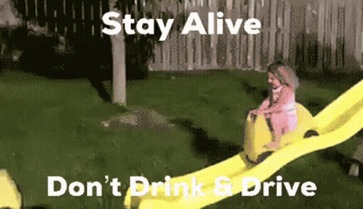 Man Riding Yellow Water Slide Stay Alive Don't Drink & Drive GIF