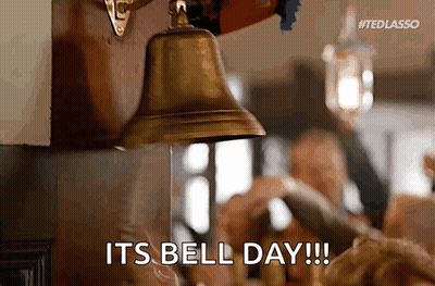 Man Ringing Bell In Front Of Simpatico Systems LLC Sign GIF