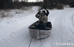 Man Row The Boat On Snow While Drinking GIF