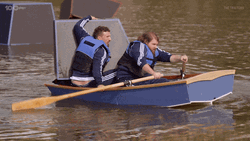 Man Row The Boat While Carrying Big Block  GIF
